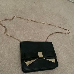 Black and gold leather bow purse by Urban Expressions.